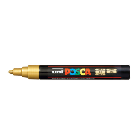 A uni POSCA paint marker shown horizontally against a white background. The glossy black cylindrical barrel carries the colourful POSCA branding and is topped by a uni clip, with the coloured cap or exposed bullet nib indicating the paint colour inside.