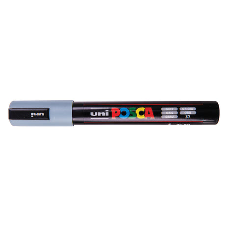 A uni POSCA paint marker shown horizontally against a white background. The glossy black cylindrical barrel carries the colourful POSCA branding and is topped by a uni clip, with the coloured cap or exposed bullet nib indicating the paint colour inside.