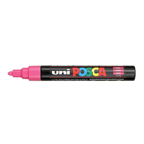 A uni POSCA paint marker shown horizontally against a white background. The glossy black cylindrical barrel carries the colourful POSCA branding and is topped by a uni clip, with the coloured cap or exposed bullet nib indicating the paint colour inside.
