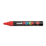 A uni POSCA paint marker shown horizontally against a white background. The glossy black cylindrical barrel carries the colourful POSCA branding and is topped by a uni clip, with the coloured cap or exposed bullet nib indicating the paint colour inside.