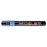 A uni POSCA paint marker shown horizontally against a white background. The glossy black cylindrical barrel carries the colourful POSCA branding and is topped by a uni clip, with the coloured cap or exposed bullet nib indicating the paint colour inside.