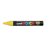 A uni POSCA paint marker shown horizontally against a white background. The glossy black cylindrical barrel carries the colourful POSCA branding and is topped by a uni clip, with the coloured cap or exposed bullet nib indicating the paint colour inside.