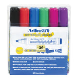 Clear plastic case containing six Artline 579 Whiteboard Markers in black, red, blue, green, magenta, and purple with chisel tips. Packaging displays Shachihata branding, dry safe ink badge, and features including dense colour, low odour, and cap can be left off for 48 hours without drying out.