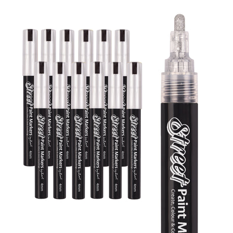 A set of Street Paint Markers by Zart with silver caps is shown alongside a close-up of the marker tip. The nib has a metallic silver sheen, complementing the smooth black barrel and bright reflective cap finish.
