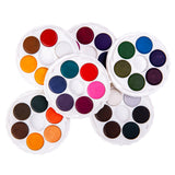 Six stacked circular Micador Brilliant Water Colours discs overlap on a white background, showing varied colour families including warm oranges, reds and browns, pinks and purples, cool blues and greens, plus neutral greys, whites and blacks in white plastic trays.