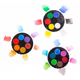Set of three round paint palettes with colorful paint samples on a white background