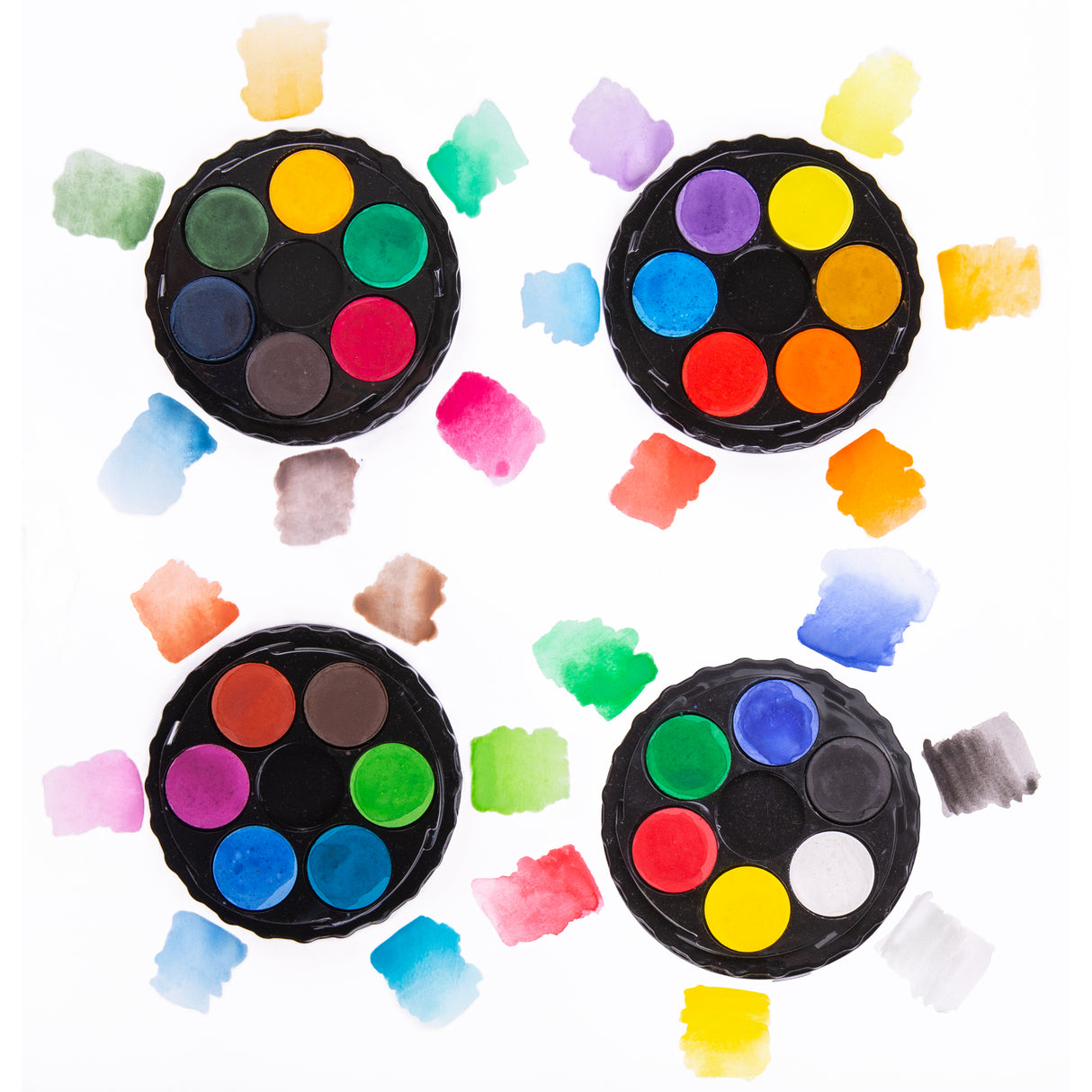 Four round color palettes with watercolor swatches on a white background