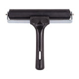 Close-up of a hard rubber roller with a wider black cylindrical surface held in a metal frame, set against a light grey background. The black handle has a smooth finish with a vertical hanging hole, emphasising durability and clean, minimal form.