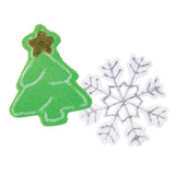 Two festive shapes cut from Zart Craft Fun Foam Coloured Sheets: a textured green Christmas tree with a gold glitter star at its peak and pale outlined branch details, paired with a white foam snowflake featuring intricate silver glitter tracing across its six pointed arms.