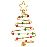 A decorative Christmas tree shape hand-formed from Zart Aluminium Armature Wire in gold, coiled into tiered zigzag branches and topped with a wire star, threaded with red, green and clear glass beads along its length, finished with a spiral coil at the base.