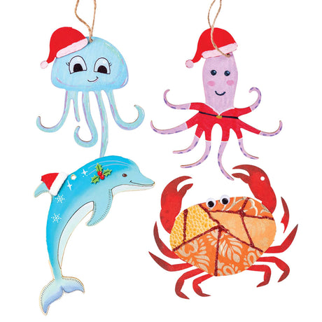Four Zart Wooden Australian Shapes hung on jute string, hand-painted as festive sea creatures in red Santa hats: a smiling blue jellyfish with curling tentacles, a jumping dolphin decorated with snowflakes and holly, a purple Santa-suited octopus, and a red crab with joggle eyes and a glittered orange textured shell.