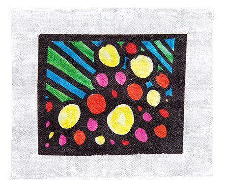 Vibrant artwork sample on white fabric showing colourful circles in yellow, orange, pink and red with diagonal striped rays in blue and green on black background, demonstrating Magic Image Laser Printer Transfer Paper results on textile material.
